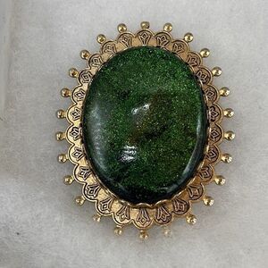 Vintage Green sparkling resin type cabochon brooch.